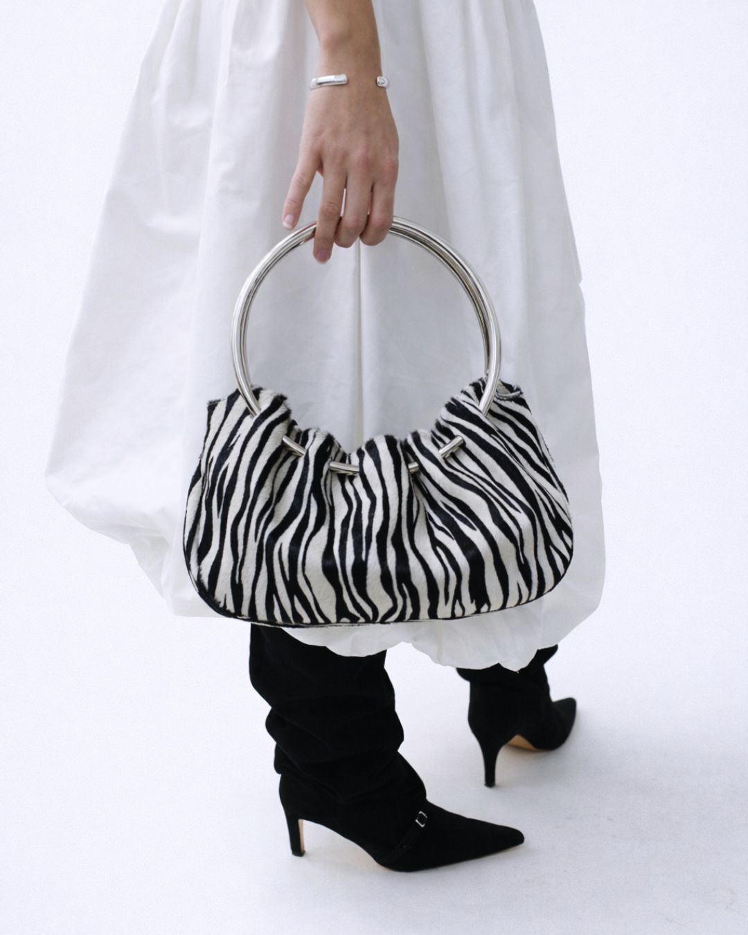 KALDA zebra-striped handbag with a plain white background