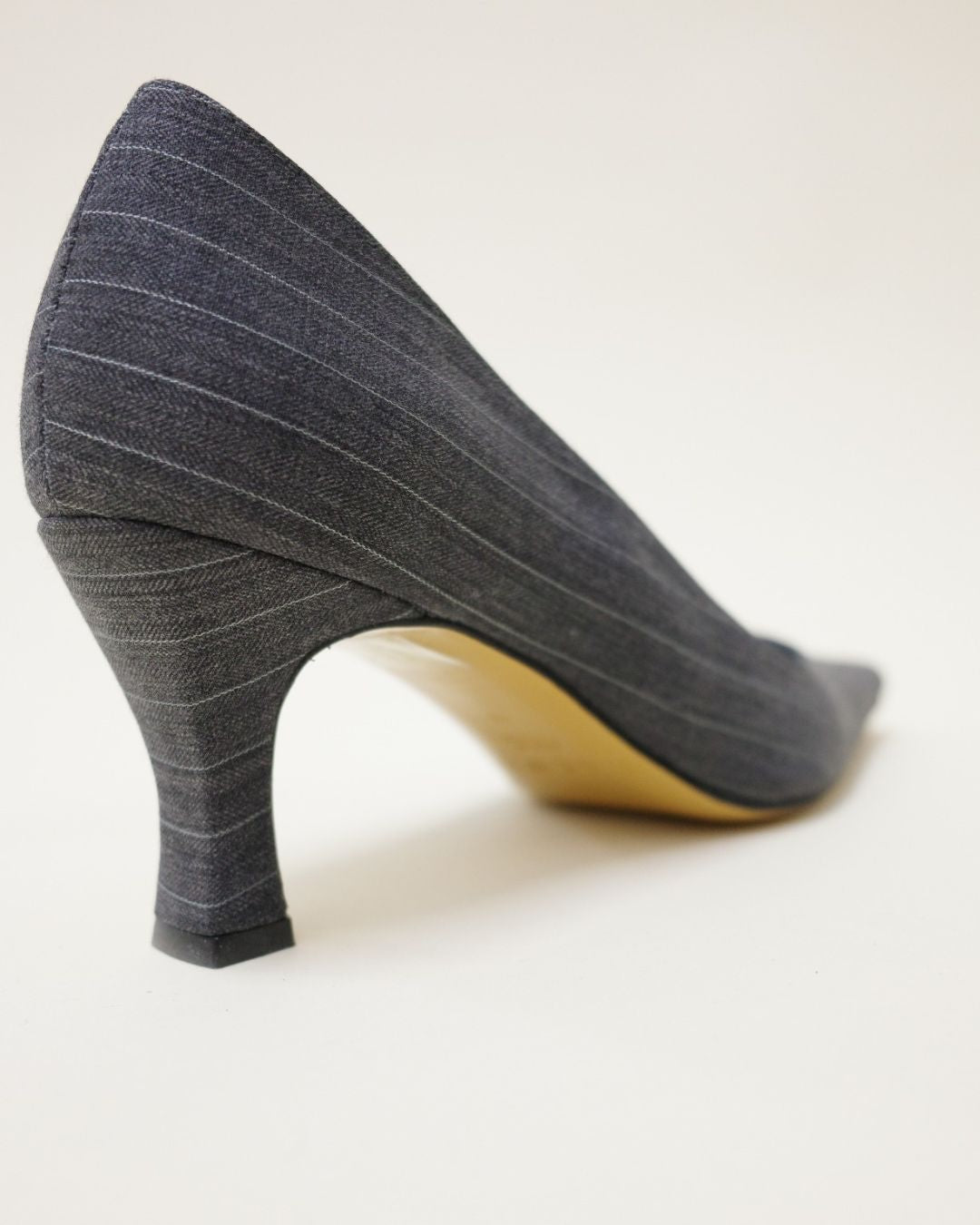 KALDA Gray high-heeled shoe on a white background back view