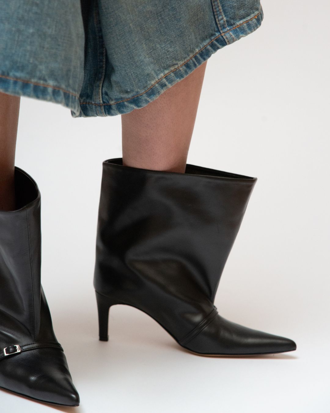 KALDA black boot with a pointed toe and wide shaft.  A close up.