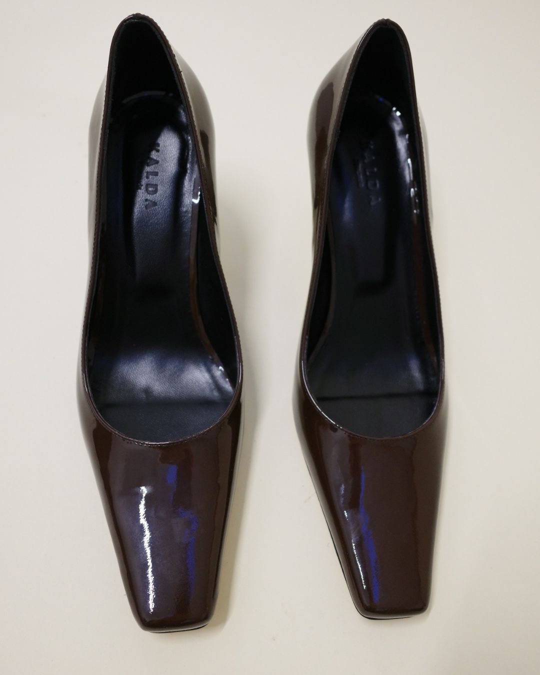 Pair of KALDA brown patent leather square toe heels