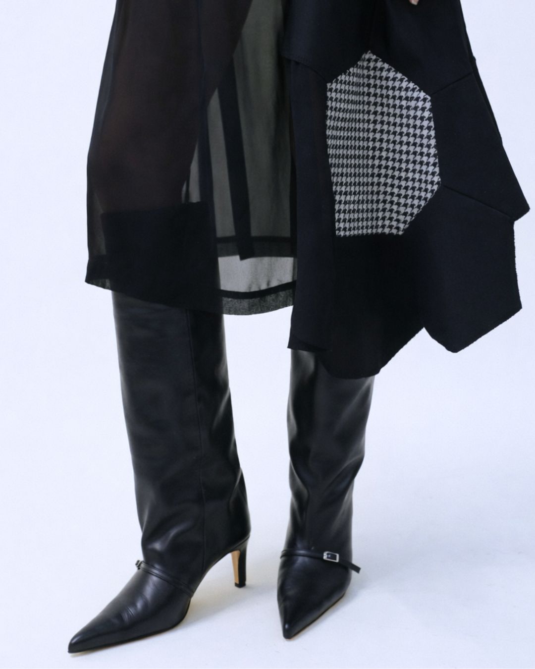 KALDA Black knee-high boots on the foot