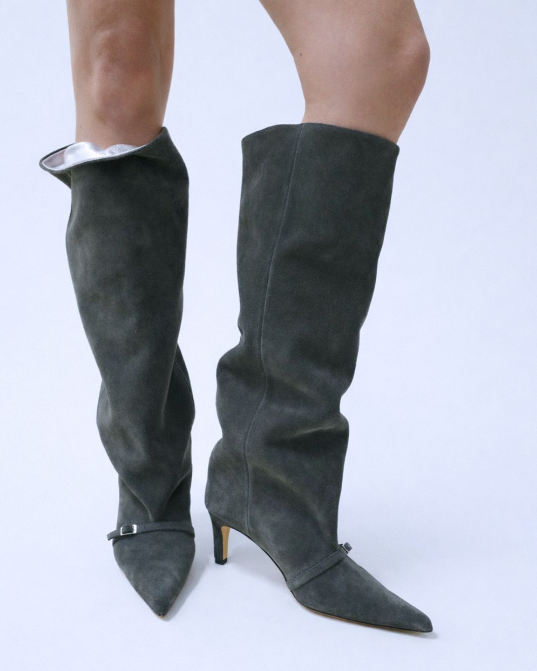 KALDA gray knee-high boots with silver accents on a white background