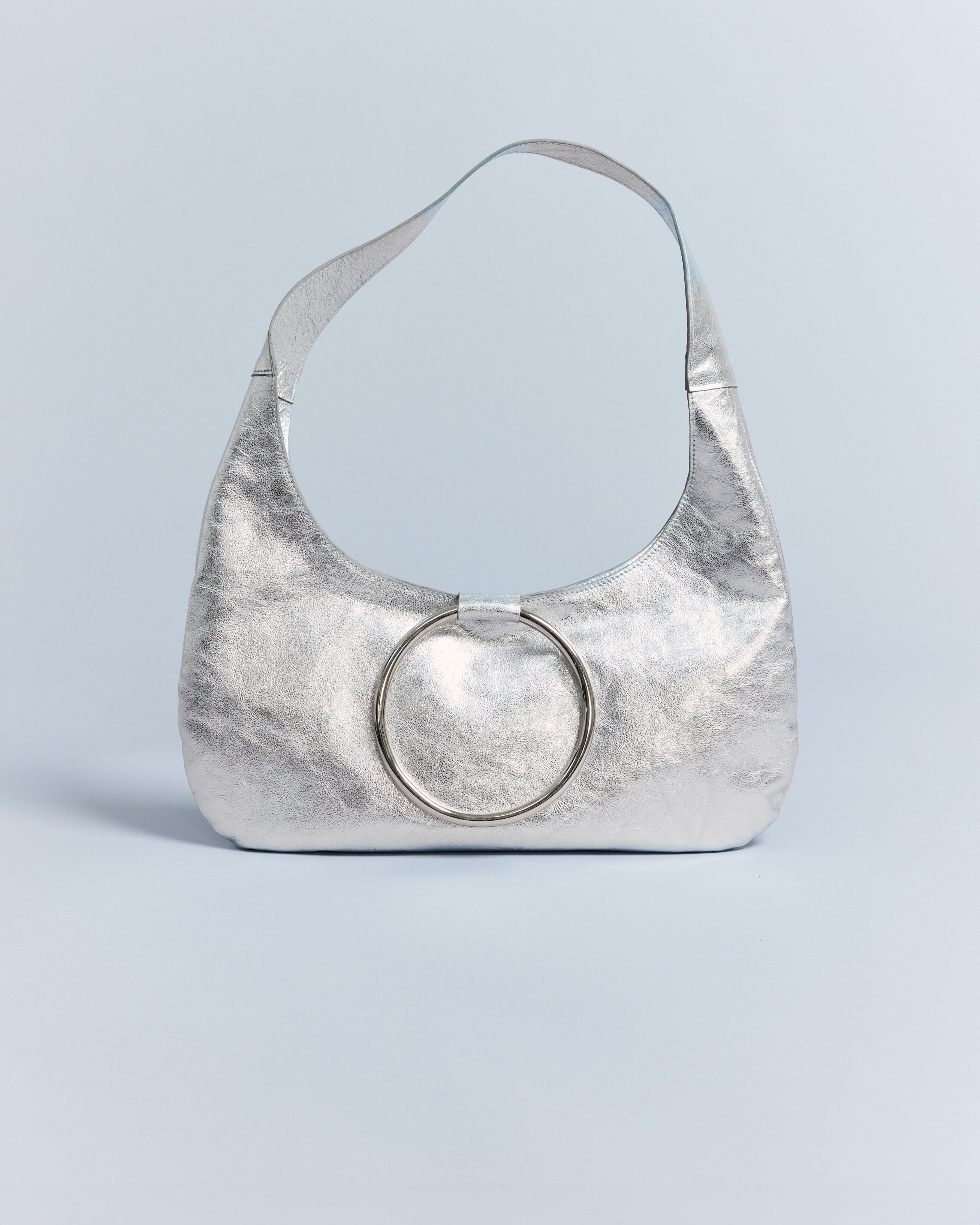 KALDA silver metallic handbag with a circular handle, front view